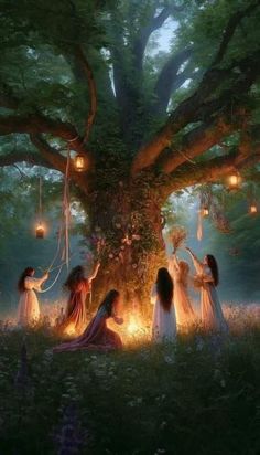 four women are gathered around a large tree with lanterns hanging from it's branches