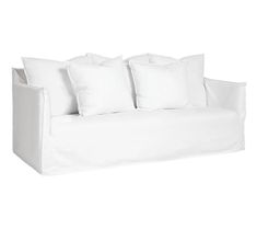 a white couch with four pillows on it's back and one pillow in the middle