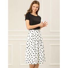 From Monday to Sunday, this skirt is effortless to throw on. Crafted from a lightweight fabric, this skirt features polka-dots prints, an elastic waist, a waist belt, and an A-line silhouette. Simple and vintage, the waist belt lends an elegant touch, making this skirt an option for your next social gathering. With the design of an elastic waist, this skirt can accentuate your graceful figure. Pair it perfectly with sandals or high heels for a stylish look. Polka Dot Knee-length Flowy Skirt, Knee-length Polka Dot Flowy Skirt, Trendy Overalls, Purses Vintage, Basic Blouses, Knee Length Skirt Pencil, Printed Midi Skirt, Black Midi Skirt, Women's Skirts