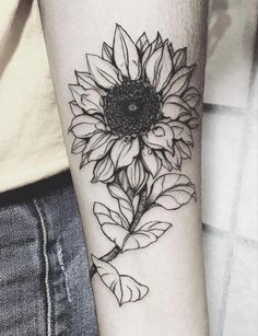 a black and white photo of a sunflower on the arm