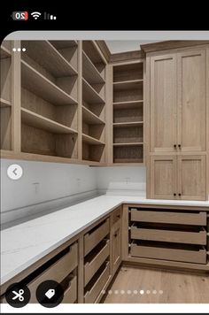 a kitchen with wooden cabinets and white counter tops