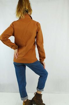 "Unisex 60s Style French Chore Jacket Duck Brown Cotton Canvas - Various Sizes Available - Made from 100% canvas cotton with tarnished antiqued bronze button rivets, buttoned cuffs and 4 useful pockets to the front. - Really easy to pair with jeans and boots or a dress. - Unisex garment. ABOUT Made to a 100% unique design specification, as designed by us at Wolf Vintage; not to be found anywhere else on the market, online or in store. Having specialised in selling vintage navy chore jackets or ' Brown Long Sleeve Utility Jacket With Snap Buttons, Brown Button-up Utility Jacket With Snap Buttons, Brown Collared Utility Jacket With Buttons, Brown Utility Jacket With Snap Buttons For Work, Fall Cotton Outerwear With Button Zip Fly, Brown Utility Jacket With Buttons, Retro Long Sleeve Utility Jacket For Fall, Vintage Utility Jacket With Buttoned Pockets For Work, Retro Fall Utility Jacket For Work