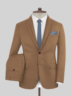 A tribute to timeless style is our Napolean Caramel Brown Wool Suit that whispers the tales of a modern-day merchant of sophistication. Clad in a bespoke trend - our suit, made from wool fabric, savors warmth and resilience with a rust hue that's a statement of seamless grace transitioning easily from dusk to dawn. Suited for evenings of refined gatherings, where laughter mingles with the aroma of fine wine, or commanding the boardroom such is the charm of this ensemble.  Look Includes    Napolean Caramel Brown Wool  Fabric  Two Button Jacket Style  Notch Lapel  Horn Brown Buttons  Single Vent  Three Cuff Buttons  Two Welted Back Pockets on Trousers   Click 'Customize Now' to modify the look if needed.   Lining: Viscose, Dry Clean, Pants can be lightly washed. Brown Wool Suit, Grey Check Suit, Herringbone Tweed Jacket, White Linen Suit, Herringbone Jacket, Beige Suits, Black Chinos, Herringbone Tweed, Beautiful Suit