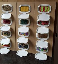 several containers are lined up on the wall to hold different foods and candys in them