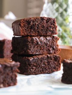 chocolate brownies stacked on top of each other