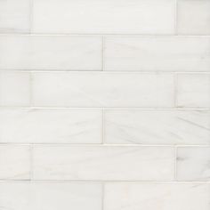 a white brick wall that is made out of marble