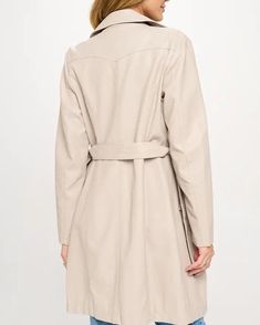 Add some edge to your wardrobe with our Vegan Leather Trench Coat in Cream. Made from high-quality vegan leather, this coat is not only stylish but also ethically conscious. Perfect for any season, this versatile coat will elevate any outfit. DESIGN DESCRIPTION: Vegan Leather Trend Coat, Double Breasted, Belted Closure Types: Dual: Button Fit: Layer style - TRUE TO SIZE Length: Above Knee Outer: 100% Polyurethane Underlay: 100% Viscose Lining: 100% Polyester Faux Leather Belted Outerwear For Work, Belted Faux Leather Outerwear For Work, Faux Leather Long Coat For Office, Spring Leather Workwear Outerwear, Leather Outerwear For Workwear In Spring, Spring Belted Leather Long Coat, Spring Long Belted Leather Jacket, Spring Leather Long Coat, Elegant Faux Leather Outerwear For Spring