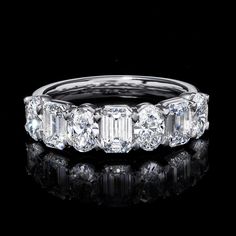 a diamond ring on a black background