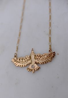 Necklace completed with a handcrafted etched eagle. Finished with a gold-filled Figaro chain. completed with a genuine white opal. Approx. 16”+ 2" extender Handcrafted pendant Figaro Chains, Figaro Chain, White Opal, Gold Filled, Opal, Gold Necklace, Sterling Silver, Chain, Stone