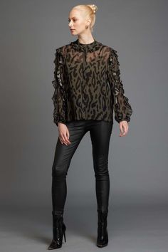 The Fate + Becker Dreaming Top in Khaki animal print is full of surprises. It features a Mandarin style collar with frill edge that adds a touch of elegance to this blouse. The long sleeves with frill detail add a haute couture element and as an added bonus, there is a concealed placket with gold top button. This blouse also has a black lining for added comfort and privacy. This blouse is not only stunning in design but also incredibly versatile. The Khaki animal print is a bold statement that can be dressed up with a sleek pair of black trousers for a night out or paired with your favorite jeans for a more casual look. The loose fit of the blouse makes it comfortable and flattering for any body type, while the luxurious fabric drapes effortlessly over your curves. The Fate + Becker Dreami Long Sleeve Summer Dress, Maxi Dress Winter, Frill Tops, Linen Loungewear, Frill Sleeves, Sleeveless Dress Summer, Swimwear Sale, Skirted Swimwear, Bold Fashion