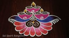 this is an image of a colorful rangolite design for diwaling on the floor