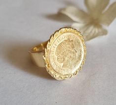 Gold coin ring, coin pinky ring, gold signet ring, coin signet ring, cocktail ring vintage style coin ring, vintage gold ring, pinky ring This gold coin ring is made of a British 5p coin which was decorated with braided gold filled wires and attached to a wide handmade band, creating a lovely signet ring. The coin coin ring is designed in a vintage style and is available both in 14k gold plating over brass or silver as well as sterling silver (see last photo). The ring is a great cocktail ring a Vintage Engraved Coin Signet Ring, Vintage Coin Signet Ring As Gift, Vintage Coin Shaped Signet Ring Gift, Vintage Coin Signet Ring For Gift, Gold Coin-shaped Engraved Signet Ring, Gold Engraved Coin Signet Ring, Vintage 14k Gold Coin Ring, Gold Coin-shaped Engraved Ring, Elegant Engraved Coin Rings