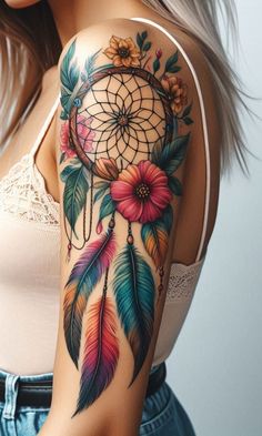 a woman with a tattoo on her arm has a dream catcher and flowers in it