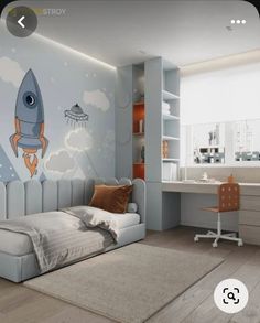 a room with a bed, desk and wallpaper on the walls that has a rocket ship painted on it