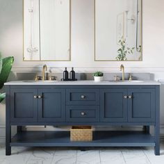 a bathroom with two sinks and mirrors on the wall next to a potted plant