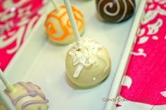 there are many different types of candies on the trays with candy sticks in them