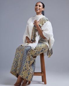 This Shimena Habesha dress is a true masterpiece that combines traditional elegance with modern style. The dress features an intricate pattern that is carefully crafted to create a stunning visual effect. The pattern is complemented by a beautiful Tibeb design, which adds a touch of traditional charm to the overall design. The dress is designed to fit comfortably and flatteringly, with a fitted bodice and a full skirt that flows beautifully as you move. The dress is made with high-quality fabric Eritrean Dress, Ethiopian Clothing, Habesha Dress, Ethiopian Traditional Dress, Ethiopian Dress, Habesha Kemis, Art Africain, Cultural Events, Jan 11