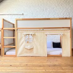 a bunk bed with curtains on the top and bottom