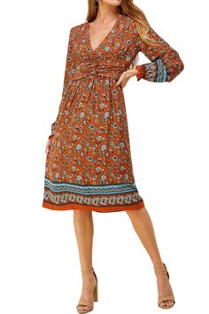 The Bohemian Printed Midi Dress from Iconic Luxe combines artistic flair, comfort, and practicality. Its unique design elements and Bohemian-inspired prints make it a standout choice for expressing your individual style. This dress is versatile and can be dressed up or down. It's suitable for casual outings, daytime events, or even dressed up for special occasions, depending on your styling choices. To complete your look, consider adding accessories such as delicate necklaces, oversized sunglass Brown Printed Flowy Dress, Vibrant Printed Fall Dress, Hippie Patterned Printed Dress, Bohemian Paisley Print Midi Dress For Fall, Bohemian Midi Dress With Abstract Print, Brown Bohemian Printed Dresses, Bohemian Brown Printed Dresses, Hippie Brown Floral Print Dress, Bohemian Multicolor Dress With Vintage Print