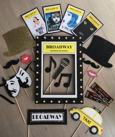 the broadway props are laid out in front of each other on a wooden floor with pins and magnets