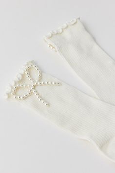 Oh-so-soft statement embellished socks topped with a pearl-beaded bow for a sweet touch. Features Pearl bow ribbed socks Coquette ribbed knit socks Lightweight feel Femme pearl-beaded bow accent Content + Care 95% Cotton, 3% polyester, 2% spandex Machine wash Imported Size Crew sock length | Pearl Bow Ribbed Sock in Ivory, Women's at Urban Outfitters Socks Coquette, Beaded Bow, Australia Clothes, Ribbed Socks, Pearl Bow, Crew Sock, Wellness Gifts, Brand Sale, Fall Favorites