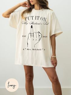 Make your bachelorette party unforgettable with our "Put It on My Husband's Tab" Unique Bride to Be Shirt! This cute and funny tee is the perfect bachelorette party favor and a delightful engagement gift for the bride. Designed to celebrate your upcoming wedding and honeymoon, this Mrs. Wife Tee is a must-have for any bride-to-be. Crafted from high-quality, soft fabric, this shirt offers comfort and style, making it ideal for bachelorette celebrations, honeymoon adventures, or simply showing off Hen Do Outfits For Bride, Bride T Shirt Ideas, Bride To Be Outfit Ideas, Bride To Be Shirts, Hen Do Outfits, Engagement Gifts For Bride, Adventurous Honeymoon, Engagement Humor, Sleep Shirt Dress