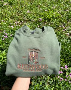 Embroidered Redwood National Park Unisex Sweatshirt, Embroidered California Tshirt, Woodland Embroidered Sweatshirt, California Redwood Embroidery, CA Woodland USA National Parks Introducing our Embroidered Redwood National Park Sweatshirt, a cozy homage to the awe-inspiring redwoods -Nature's Elegance: Intricately embroidered Redwood National Park design. -Comfortable & Cozy: Soft fabric for nature lovers on the go. -Perfect Gift: Ideal for park enthusiasts or as a treat for yourself -------- - National Park Sweatshirt Outfit, Granola Shirts, National Park Shirts, National Park Design, National Park Sweatshirt, National Park Shirt, Redwood National Park, Park Design, Music Festival Outfits