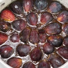 the plums are being soaked in water and ready to be cooked on the stove