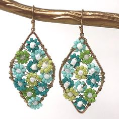 Handmade And One Of A Kind Earrings That I Sell In My Stores. Color Combinations Are Limitless And I Will Take Custom Orders. Seed Beads Are Strung On Brass Wire And Formed Into Each Flower. The Flowers Are Secured To The Frame And On To The Next Flower. Very Time Consuming Process, But The Finished Product Is Gorgeous. Blue Teardrop Jewelry For Spring, Turquoise Dangle Jewelry For Spring, Spring Turquoise Flower Earrings, Handmade Turquoise Earrings For Spring, On To The Next, Earring Ideas, Funky Jewelry, Creating Jewelry, Design Jewelry