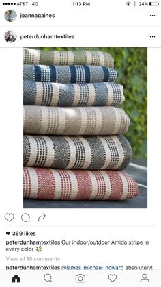 a stack of rugs sitting on top of a table