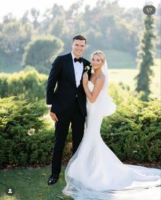 a bride and groom posing for a photo