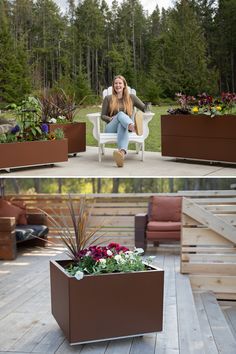 a woman sitting in a chair on top of a wooden deck next to a planter filled with flowers