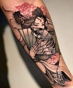 a person with a tattoo on their arm holding a fan and wearing a kimono