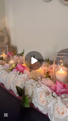 a table with candles and flowers on it