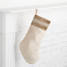 a christmas stocking hanging from a fireplace mantel