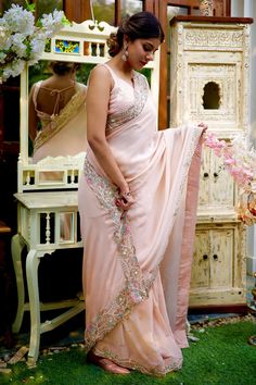 Dusty pink crepe saree with pearl, bead, cutdana, stone embroidered floral motifs. Paired with blouse.
Components:2
Pattern:Embroidery
Type of Work:Pearl, bead, cutdana, stone, floral
Neckline:Sweetheart
Sleeve Length:Sleeveless
Fabric:Crepe, sequin georgette
Color:Pink
Other Details:
Back deep V neck
Back tassel tie-up
Occasion:Wedding - Aza Fashions Designer Pearl Embroidered Saree For Diwali, Designer Wear Pearl Embroidered Saree For Diwali, Designer Pearl Embroidery Saree For Diwali, Designer Diwali Saree With Pearl Embroidery, Designer Georgette Saree With Pearl Embroidery, Festive Georgette Saree With Pearl Embroidery, Bollywood Style Pearl Embroidered Georgette Blouse Piece, Traditional Georgette Saree With Pearl Embroidery, Bollywood Style Georgette Blouse With Pearl Embroidery