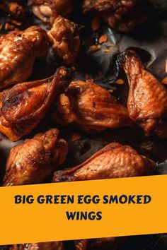 some chicken wings with the words, big green egg smoked wings on it's side