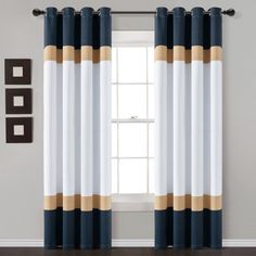 the curtains are hanging in front of a window with blue and white stripes on it