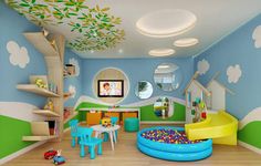 the children's room is decorated in blue, green and yellow colors with lots of toys