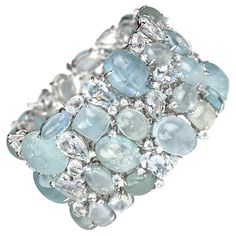 A multi stone aquamarine bracelet, made by Moira, set with mixed cuts of faceted and cabochon aquamarines, weighing an estimated 369.00ct, and round brilliant-cut diamonds weighing an estimated 0.91ct, mounted in 18ct white gold. With a push-in tongue and box clasp. Diamond Gold Bracelet, Vintage Gold Bracelet, White Gold Drop Earrings, Jewel Design, Clay Silver, Gold Heart Bracelet, Platinum Bracelet, Retro Bracelet, Aquamarine Bracelet