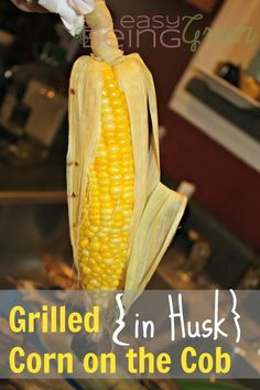 grilled 3 in husk corn on the cob with text overlay that reads grilled 3 in husk corn on the cob