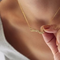 100% real. It's not plated Here is a dainty, delicate and simple, yet classy minimalist 14K Solid Gold Arabic Name Necklace. The perfect gift for yourself and your loved ones This is 14k Solid Gold. (you may see the 14k stamp available on the chain) Features [] Made to Order [] Material Option: 14K Solid Gold (Both Name and the Chain) []Dimensions: Depending on your font choice, height sizes range from 10mm to 6mm lowercase. [] Color Options: 14kYellow Gold-14KWhite Gold PACKAGE 🎁 All items are Arabic Name Necklace, Classy Minimalist, Arabic Jewelry, Arabic Names, Gold Design, Name Necklace, Chain Lengths, Simple Designs, Solid Gold