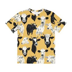 Embrace the rustic beauty of the countryside with our Pastoral Charm Cow Print All-Over Tee. Adorned with an array of cow portraits set against a warm, mustard-yellow backdrop, this tee is a nod to pastoral bliss and farmyard favorites. It's the perfect pick for: Adding a touch of whimsical country charm to your wardrobe 🐄 Soft, breathable fabric that ensures comfort whether you're out in the field or in the city 🌾 A playful, yet stylish design that's sure to start conversations and bring smil Fall Yellow Printed T-shirt, Yellow Printed T-shirt For Fall, Vibrant Clothing, Yellow Backdrop, Rural Lifestyle, Cow Face, Spread Positivity, Unique Accessories, Country Charm