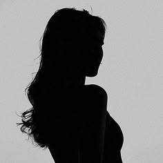 the silhouette of a woman is shown in black and white