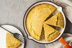 a cake in a pan with one slice cut out and the rest on a plate next to it