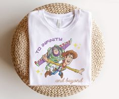 a t - shirt with an image of toy story characters on it