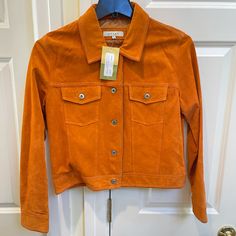 Net Sorb Tangerine Orange Suede Jacket. Vintage 90s Suede In Tangerine With Snap Button Fastening And Two Breast Pockets. Could Be Worn With Buttons Open Or Closed. Spring Leather Jacket With Snap Buttons, Spring Leather Jacket With Lapel Collar And Buttons, Fitted Leather Jacket With Buttons For Spring, Collared Single Breasted Leather Jacket For Spring, Spring Collared Single Breasted Leather Jacket, Spring Single-breasted Leather Jacket With Long Sleeves, Spring Single Breasted Collared Leather Jacket, Single-breasted Long-sleeve Leather Jacket For Spring, Spring Collared Single-breasted Leather Jacket