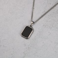 Silver Onyx Pendant Chain Necklace FREE & Fast Shipping! *Premium Stainless Steel *Color: Steel *Pendant Length is 22 Millimeters *Polished Onyx Gemstone *Available with 20 Inch or 22 Inch Length Micro Chain *We Recommend 1mm or 2mm Width Chains to Fit Pendant *Will not tarnish, fade, or discolor *Safe in Water *Pendant is removable *Also available in Gold **Check out the rest of our Pendants Collection here --> https://www.etsy.com/shop/famedgoodsnyc?section_id=35454751 Shipping Time -Allow 1-2 Minimalist Black Dog Tag Jewelry, Black Pendant Chain Necklace, Tarnish Resistant, Black Tarnish Resistant Pendant Chain Necklace, Black Tarnish Resistant Pendant Necklace, Black Tarnish-resistant Pendant Chain Necklace, Black Metal Dog Tag Necklace, Black Stainless Steel Dog Tag Necklace, Black Stainless Steel Dog Tag Jewelry, Rectangular Black Metal Jewelry