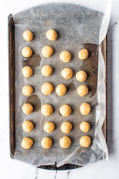 doughnut holes on a baking sheet ready to go into the oven