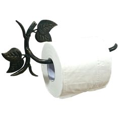 a roll of toilet paper sitting on top of a leafy metal holder with leaves